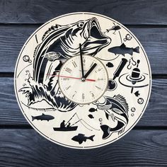 a clock that is on the side of a wooden wall with fish and other things around it