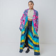 Zinnia Pearl Complete your look with this gorgeous tiedye kimono featured in a shapeless, flowy silhouette and open front style with an eye-catching allover hand tiedye design, wide, dropped sleeves. Size: One plus size Color: multicolor  Finish: super soft, Comfortable, matte, drape well Weight: medium Measurements:  bust 64 in (relaxed) Waist 72 in Sleeve Length: 29 in Length: 55 in Armholes width 12.5 in Fabrics: 100% cotton - high quality knit jersey fabric - light stretch Details: Open fron Spring Tie Dye Kimono With Kimono Sleeves, Tie Dye Kimono For Festivals, Tie-dye Kimono With Kimono Sleeves For Festivals, Festival Tie-dye Kimono With Kimono Sleeves, Festival Tie-dye Kimono, Spring Festival Tie Dye Kimono, Casual Tie Dye Kimono For Spring, Casual Tie-dye Kimono For Spring, Spring Tie Dye Kimono For Beach Cover-up