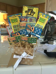 a bunch of lucky charms in a box on a counter top with a ribbon tied around it