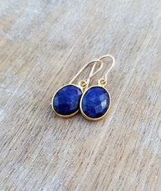 Blue Lapis Lazuli Gemstone Earrings, Lapis Lazuli Earrings Gold, Oval Shape Gemstone Earrings, Small Dainty Lapis Lazuli Dangle Earrings Small, faceted, oval-shaped lapis lazuli gemstones dangle and drop from 14k gold filled ear wires. These small, dainty earrings are just the right size, not too big and not too small! The total length of the earrings is approximately 1 inch. The small lapis lazuli gemstones are about 1/2 inch long and about 3/8 inch wide. Lapis lazuli is one of the birthstones Oval Gemstone Teardrop Earrings As Gift, Oval Faceted Earrings As Gift, Oval Faceted Earrings For Gift, Pierced Oval Teardrop Earrings For Gifts, Lapis Lazuli Earrings, Lapis Lazuli Gemstone, Blue Lapis Lazuli, Blue Lapis, Dainty Earrings