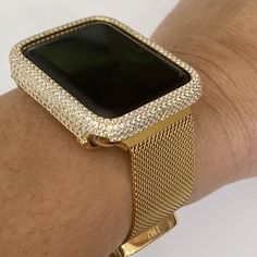 Glitz Your Apple Watch With A Graceful And Elegant Sparkle Zirconia Bezel. A Fashion Statement To Compliment Your Look! This Well-Crafted Bezel Is Made Of Sterling Silver With High-Quality Plating In 14k Yellow Gold. Features Sparkling Aaaaa Zirconia ( Highest Grade = More Sparkle) In Pave Setting All Around The Watch Case. Available In 38 Mm (Small Case) Fits Apple Watch Series 2 And 3 (Non-Ceramic Case). Please Look At The Back Of Your Watch To Make Sure Is 38 Mm Prior Ordering. Note: For Seri Gold Diamond Watch With Bling, Gold Diamond Watch With Cubic Zirconia Bling, Gold Embellished Cubic Zirconia Diamond Watch, Gold Cubic Zirconia Watch As Gift, Gold Cubic Zirconia Watches For Anniversary, Gold Jewelry And Watches With Bling For Gift, Gold Diamond Watch Accessories For Anniversary, Gold Jewelry And Watches As Gift, Elegant Gold Bling Jewelry And Watches