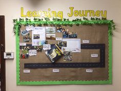 a bulletin board with pictures and writing on it that says learning journey next to a door