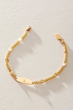 Great for gifting or gracing your own jewelry collection, this stunning bracelet is the perfect blend of cool and classic with a defined chain, satellite sunburst pendants, and personalized placket at center for a super unique finishing touch. * 14k Gold Filled 3.4mm sunburst chain * 14k Gold Filled 6x19mm hand-stamped initial pendant * Length: 7" * 5 days of production | Set & Stones Personalized Rosie Bracelet at Free People in Gold Initial Pendant, Hand Stamped, Gold Filled, Jewelry Collection, Jewelry Accessories, Jewelry Bracelets, Initials, Free People, Bracelet