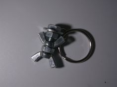 a metal keychain that has been made to look like cubes on it