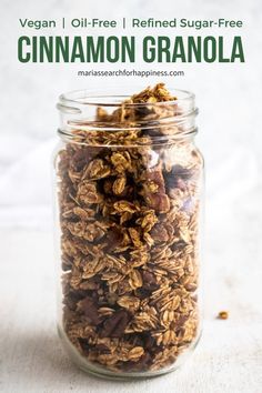 a glass jar filled with granola on top of a table