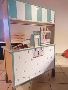 an ice cream shop counter with various items on it