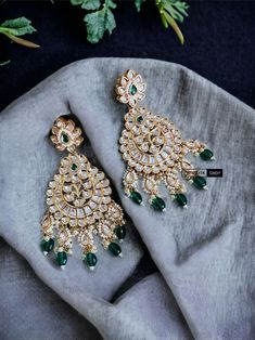 22k Gold plated Tayani chandbali Beads Stone Earrings.These 22k Gold plated Tayani chandbali Beads Stone Earrings exude elegance and luxury. The intricate design and high-quality materials make them a timeless accessory that will elevate any outfit. Experience the beauty and durability of these earrings, perfect for any occasion.