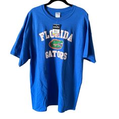 Old Varsity Brand Men’s Ncaa Florida Gators Short Sleeve T-Shirt Size Xl Nwt 100% Cotton Gildan Tag New With Tags Smoke Free Pet Free Home Fast Shipping! 24” Pit To Pit 31” Top To Bottom 156 Blue Sports Fan Tops For College, Casual Blue Shirt For Fan Gear, Brand Shirts, J Crew Men, Yellow Shorts, Florida Gators, Nike Tees, Tour T Shirts, Crew Neck Shirt