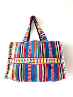 This bag was produced from the recycled handmade traditional fabric of the Andean highlands. Black lining inside with a pocket. Measurements:  Height: 12.5 inches (32 cm) Flat width: 19 inches (48 cm) Depth/Gusset: 6.5 inches (17 centimeters) Drop down strap length: 11 inches (28 cm) / Handle length: 25 inches (64 cm) Woven Cotton Bags For Daily Use, Rectangular Woven Cotton Shoulder Bag, Daily Use Woven Cotton Bags, Daily Use Cotton Woven Bag, Woven Cotton Shoulder Bag For Market, Cotton Woven Shoulder Bag For Market, Artisan Blue Tote Bag, Market Cotton Woven Shoulder Bag, Woven Cotton Tote Shoulder Bag