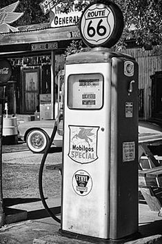 black and white photograph of an old gas pump in the 1950's or early 1960s's