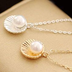 Adorable Seashell Necklace. Elegant Shell-shaped Necklace With Pearl Charm, Elegant Silver Shell Necklaces, Elegant Silver Shell Jewelry, Elegant Pearl White Shell-shaped Necklace, Elegant Silver Shell, Elegant Shell Necklace, Elegant Shell-shaped Necklace With Clavicle Chain, Giraffe Necklace, Cameo Pendant Necklace