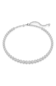 Round-cut Swarovski crystals glow in puffy settings on this emboldened take on the classic tennis necklace. 18" length Lobster clasp closure Rhodium plate/Swarovski crystal Made in Austria Tennis Necklace Swarovski, Swarovski Tennis Necklace, Tennis Necklace, Swarovski Crystal, Rhodium Plated, Lobster Clasp, Austria, Round Cut, Swarovski Crystals