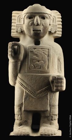 an ancient statue is shown against a black background