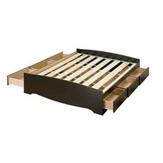 the bed frame is made up and has four drawers on each side that are open