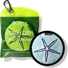 a bag with a starfish on it next to a beach day sand remover