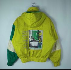 Size On Tag : Unknown Armpit To Armpit :  25 Length : 26 Material : Polyster Condition : Used item,good condition. No Holes Just Have A Few Stain And Washable. Good vintage condition. Please Refer Photo Details For Confirmation. Don't Expect The Items Is 100% Perfect Or 100% Like New Sporty Skiing Windbreaker With Adjustable Hood, Sporty Green Windbreaker For Winter Sports, Hooded Green Outerwear For Snowboarding, Green Hooded Outerwear For Snowboarding, Green Hooded Snowboarding Outerwear, Hooded Nylon Windbreaker For Ski Season, Casual Hooded Windbreaker For Skiing, Sporty Hooded Windbreaker For Ski Season, 90s Hooded Windbreaker For Winter Sports