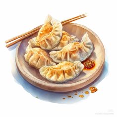 some dumplings are on a plate with chopsticks and seasoning next to them