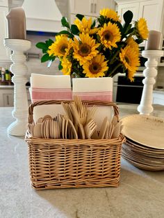 a wicker basket filled with forks and spoons on top of a kitchen counter