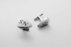 "These silver guitar pick cufflinks can be custom engraved with a name, date or monogrammed initials. These personalized cufflinks will make a special best man or groomsmen gift for your wedding party. All of our high quality cufflinks are precision laser engraved by our expert team of engravers with a very quick turnaround time. Please make sure you select your initials in the order you would like them to be engraved as we do not reformat the order once submitted. THERE ARE 3 WAYS TO PERSONALIZ Adjustable Silver Cufflinks For Personalized Gift, Classic Personalized Adjustable Cufflinks, Personalized Adjustable Jewelry For Business, Adjustable Personalized Jewelry For Business, Personalized Adjustable Cufflinks For Father's Day, Father's Day Personalized Cufflinks, Guitar Jewelry, Silver Guitar, Monogrammed Cufflinks