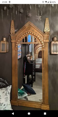 a mirror that is sitting on top of a table in front of a black wall