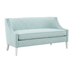 a light blue couch sitting on top of a white floor