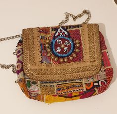 A truly exceptional tribal antique handbag, a one-of-a-kind piece. Bursting with vibrant colours, it's the perfect accessory for any occasion, whether a lively party or a casual day out. Made up of beads and wool. Perfect for your wardrobe or a gift. Has zip to close the bag. Length 11 inches by width: 9 inches Multicolor Handmade Bags For Festivals, Handmade Multicolor Bags For Festivals, Handmade Multicolor Festival Bags, Festival Handmade Rectangular Shoulder Bag, Traditional Handmade Shoulder Bag For Party, Multicolor Shoulder Bag For Festivals, Handmade Shoulder Bag For Festival Gift, Traditional Rectangular Festival Bags, Festival Gift Handmade Shoulder Bag