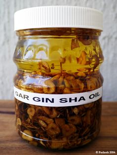 a jar filled with cashews sitting on top of a wooden table