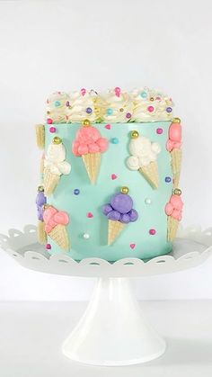 the cake is decorated with ice cream cones