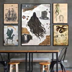 three paintings hang on the wall next to two stools in a room with tables and chairs