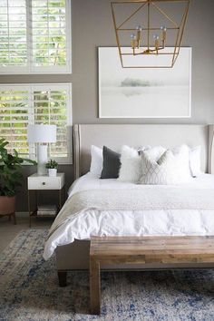 a large bed sitting in the middle of a bedroom