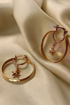 Celestial Golden Star Hoop Earring | Dainty Star Dangle Hoops | Gold Filled Hoop Earrings | Gold Hoop Earrings with Star Pendant Timeless, light & comfortable gold jewelry to wear all day, every day and forget they’re even on your ear. Details: Premium quality 18k Gold Filled Materials: Gold on Brass Measurements: Hoop Diameter: Nickel & Lead Free Hypoallergenic Your mondsee jewelry will come packaged beautifully, and will be ready for gift giving with our useful pouch to store your jewels! Trendy Hoop Earrings With Star Charm, Hoop Jewelry With Star Charm In Metal, Metal Hoop Earrings With Star Charm Dangle, Trendy Metal Hoop Earrings With Star Charm, Hoop Earrings With Star Charm, Celestial Hoop Earrings With Ear Wire, Gold Star-shaped Metal Hoop Earrings, Star Hoop Earrings, Earrings Gold Hoop