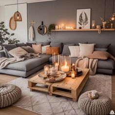 a living room filled with lots of furniture and candles on top of a coffee table