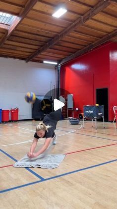 a person on a court with a ball in the air