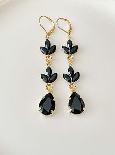 "Gorgeous pair of long earrings featuring Swarovski jet black crystals.  2 7/8\" long.  Shown in the gold metal finish. Thanks for stopping by!" Black Crystal Chandelier Earrings, Elegant Black Long Drop Chandelier Earrings, Glamorous Black Crystal Earrings For Wedding, Black Crystal Earrings For Wedding, Elegant Black Teardrop Earrings For Parties, Black Dangle Chandelier Earrings For Wedding, Black Teardrop Crystal Earrings For Formal Events, Formal Black Teardrop Crystal Earrings, Elegant Black Bridal Earrings For Formal Occasion