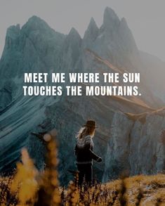 a woman standing on top of a grass covered hill with a quote above her that reads, meet me where the sun touches the mountains