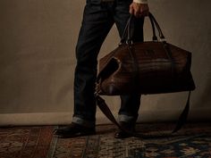 Built with Lucchese’s own giant American alligator, this signature duffle totes your essentials in first class style. Shot on location at @thebeekmanny Photography: @blairgetzmezibov Model: @tommydunn_official @fordmodels #LuccheseBootmaker #LuccheseFW24 #LuccheseNewYork French Toes, American Alligator, All Weather Boots, Handcrafted Boots, Handmade Boot, Weather Boots, Buffalo Leather, Open Storage