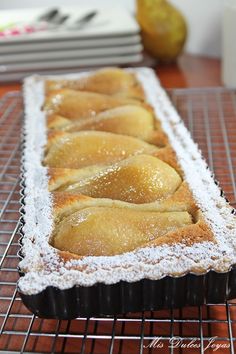 some food is sitting on a rack and ready to be baked in the oven,