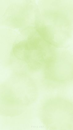 an abstract green watercolor background with some clouds in the sky and one plane flying overhead