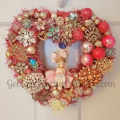 a wreath with ornaments and a doll on it