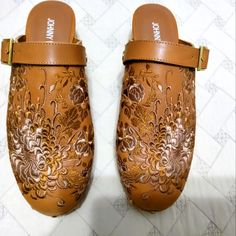 100% Embroidered Leather. Size 9m. Heel Height 2". New In A Box Never Worn. Make An Offer. Traditional Leather Clogs For Spring, Brown Mules With 4-inch Heel And Round Toe, Mules Animal, Brown Slip-resistant Synthetic Clogs, Brown Open Toe Clogs With 4-inch Heel, Artisan Brown Slip-on Mules, Brown Slip-on Mules With Stitched Sole, Brown Wedges, Suede Mules