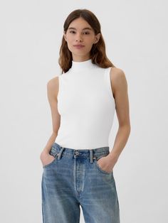 Ribbed Sleeveless Mockneck T-Shirt | Gap Factory Ribbed Turtleneck Tank Top, Solid Ribbed High Neck Tank Top, Spring Ribbed High Neck Tank Top, Solid High Neck Ribbed Tank Top, Spring High Neck Ribbed Tank Top, White Ribbed Funnel Neck Top, Ribbed High Neck Tank Top, Casual Fitted Turtleneck Top, Trendy High Neck High Stretch Tank Top