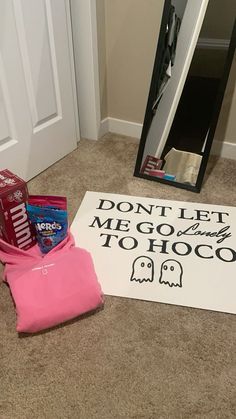 a sign that says don't let me go to hogco next to some candy