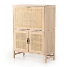 a wooden cabinet with rattan doors and drawers