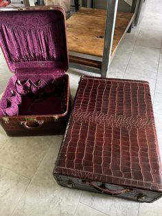 two pieces of luggage sitting on the floor