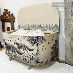 an upholstered bed with a fox design on it