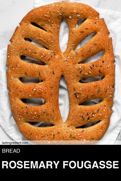 a large piece of bread that is shaped like the shape of a human head on top of a napkin