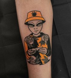 a person with an orange hat on their arm