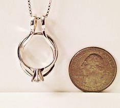 "To see all my ring holders: https://www.etsy.com/shop/AliCArt?ref=seller-platform-mcnav&section_id=19372510 The Ring Necklace Holder, also called the Engagement Ring Holder Necklace, and Wedding Ring Holder Necklace, is a great way to wear your rings when you aren't able to have them on your hands. A Ring Holder Necklace is also a meaningful way to wear the rings of someone dear to you. The BELLA ring holder pictured here is sterling silver. Bella is approx. 19mm x 33mm or 3/4\" x 1 5/16\"; Silver Jewelry With Prong Setting For Anniversary Gift, Sterling Silver Jewelry With Unique Design For Anniversary, Oval Jewelry With Unique Design For Anniversary, Unique Oval Design Jewelry For Anniversary, White Gold Jewelry With Unique Design For Wedding, White Gold Wedding Jewelry With Unique Design, Unique Oval Wedding Jewelry, Adjustable Sterling Silver Jewelry For Wedding Gift, Sterling Silver Wedding Pendant Rings