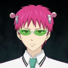 a man with pink hair and green glasses