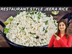 a woman standing in front of a pan filled with rice